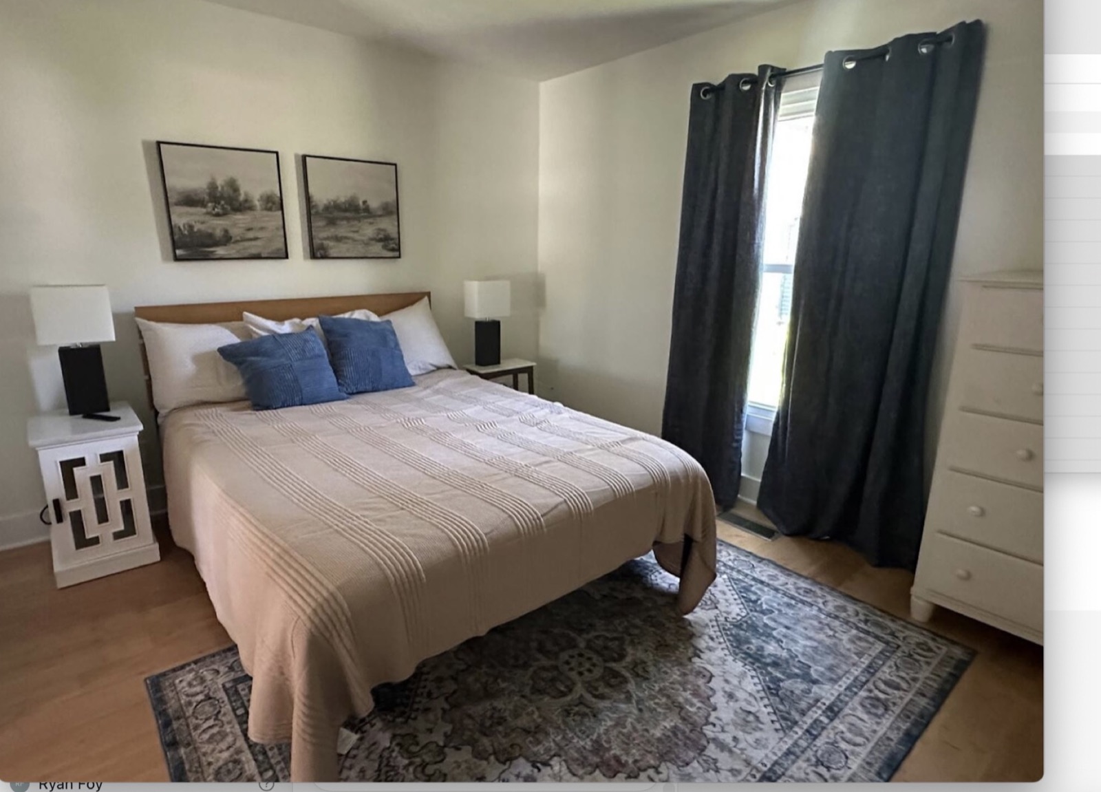 Main-floor bedroom with blue accents at Main Street Retreat
