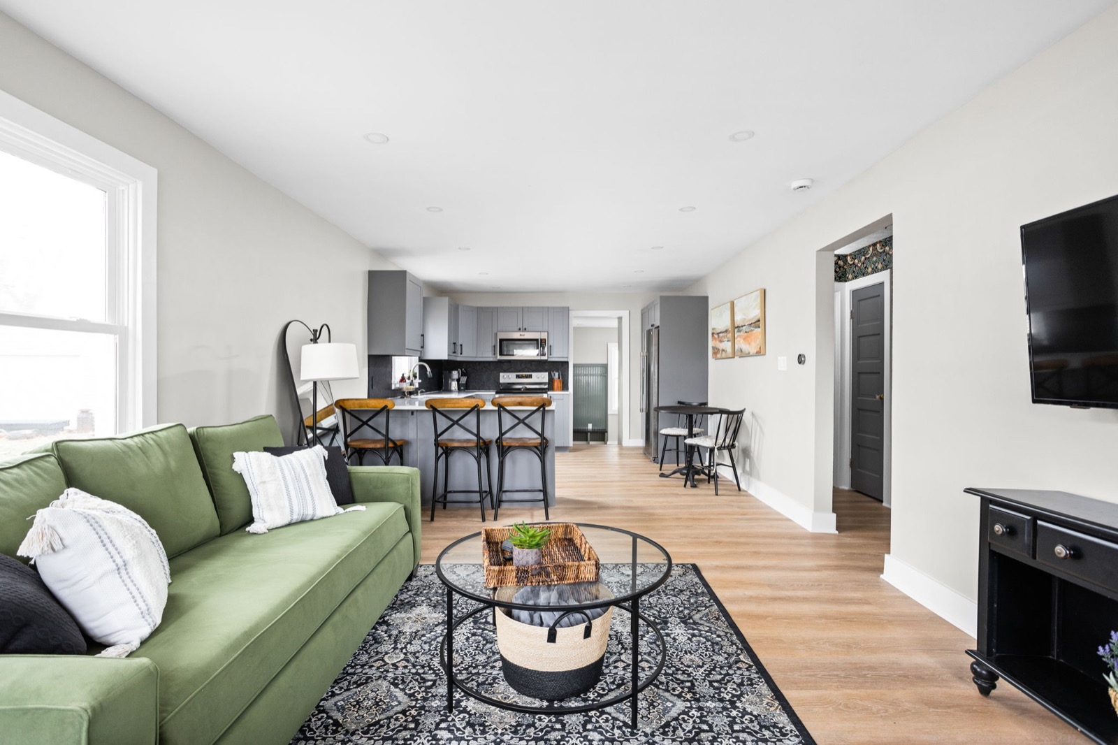 Bright living room and open kitchen at the Powell Cottage