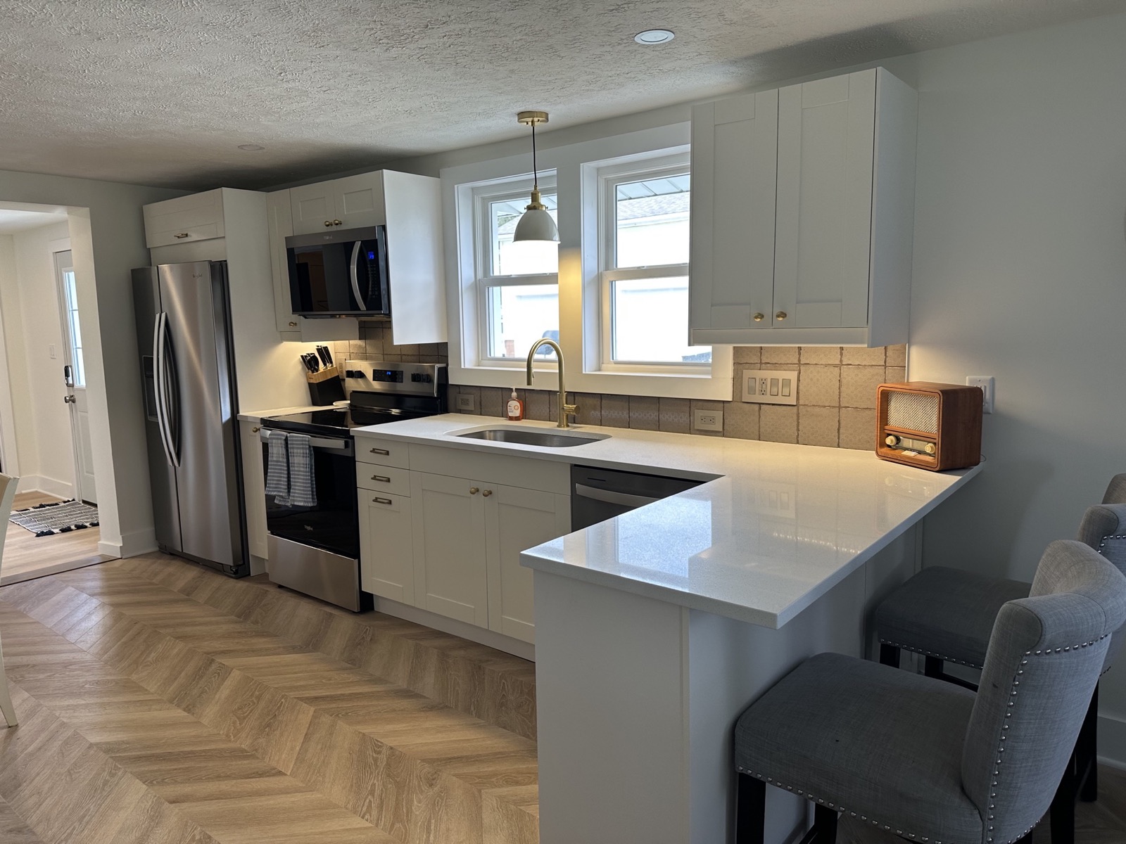 Bright, well-equipped kitchen at West Wall Retreat